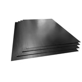 Stack of black corrugated polypropylene boards, used as protection for waterproofing membranes during construction.